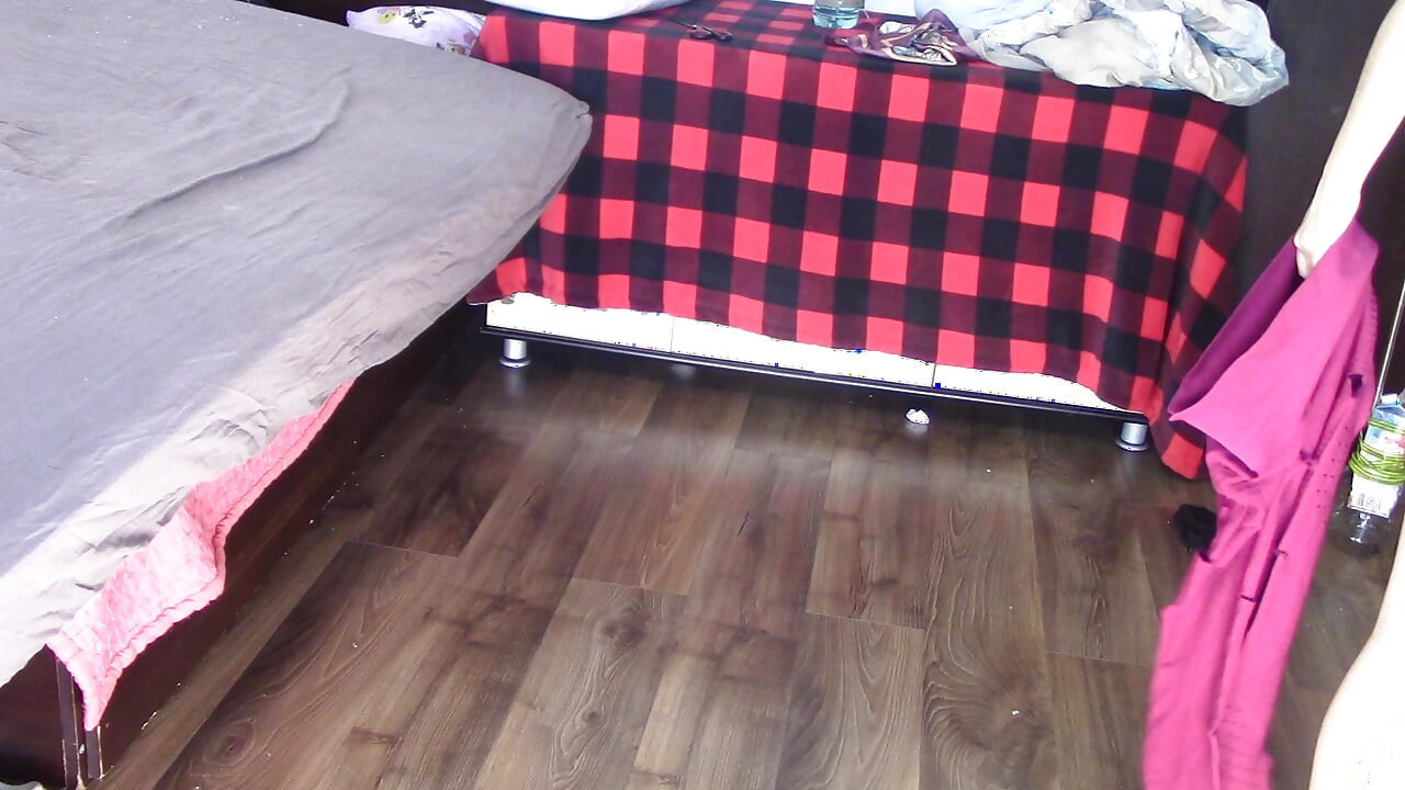 Amateur wife dancing and trying on clothes she cuts. Amateur wife vacuuming in bedroom.