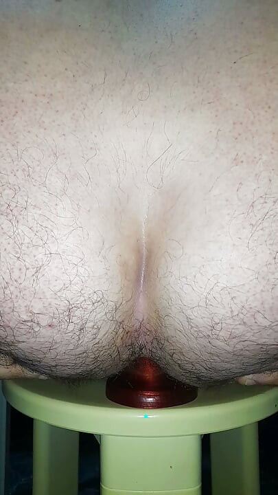 Extra-big and wide red dildo dilating and fucking my ass to the background close-up