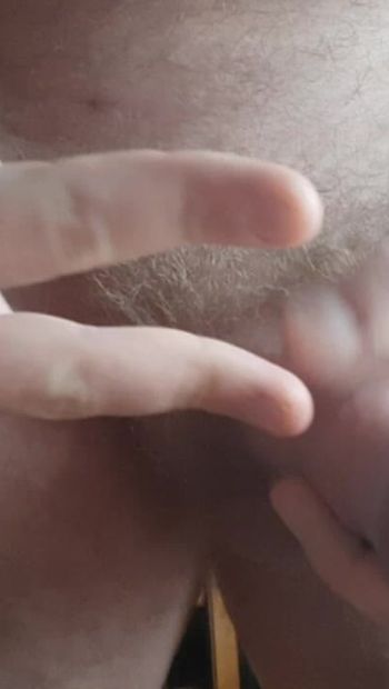 The guy jerks off a powerful cock with a big prick and cums in front of the camera