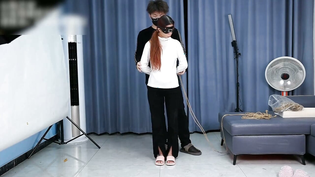 The Extreme Restraints of a Barefoot Girl, Playing with Her Bare Feet