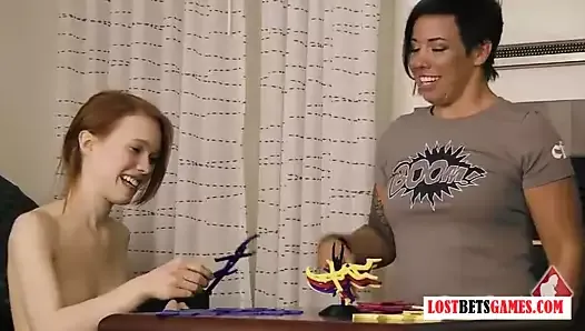 Three beautiful ladies play a strip balancing game