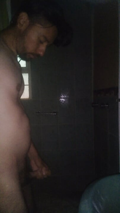 Man Showering with Flashlight On