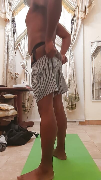 Gay men sexy gym at home with wear thong.