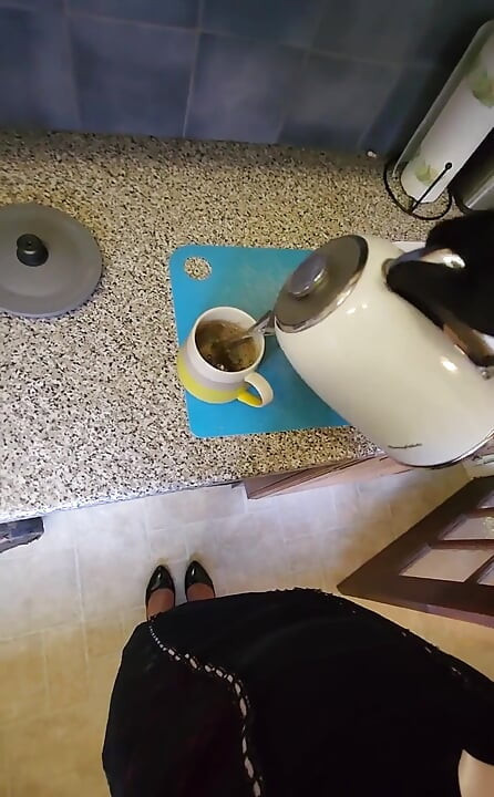 Making a morning cup in hot lingerie