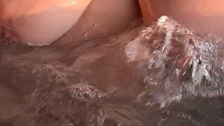 busty milf play with her tits in whirpool