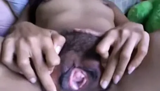 Girl uses toy on her hairy pussy, opens wide