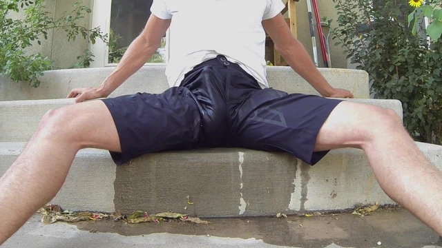 Black shorts soaked in piss