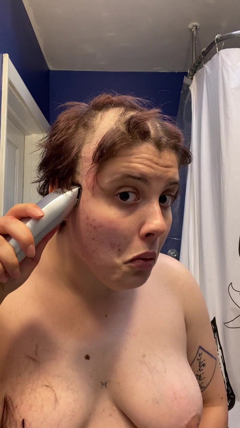 Iconic moment from "Hairless Whore - Adama Daat Amateur Fetish Head and Brow Shave"
