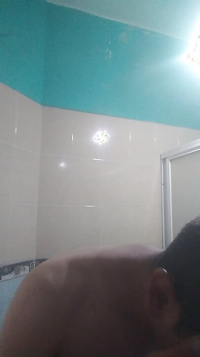 Man washes his face