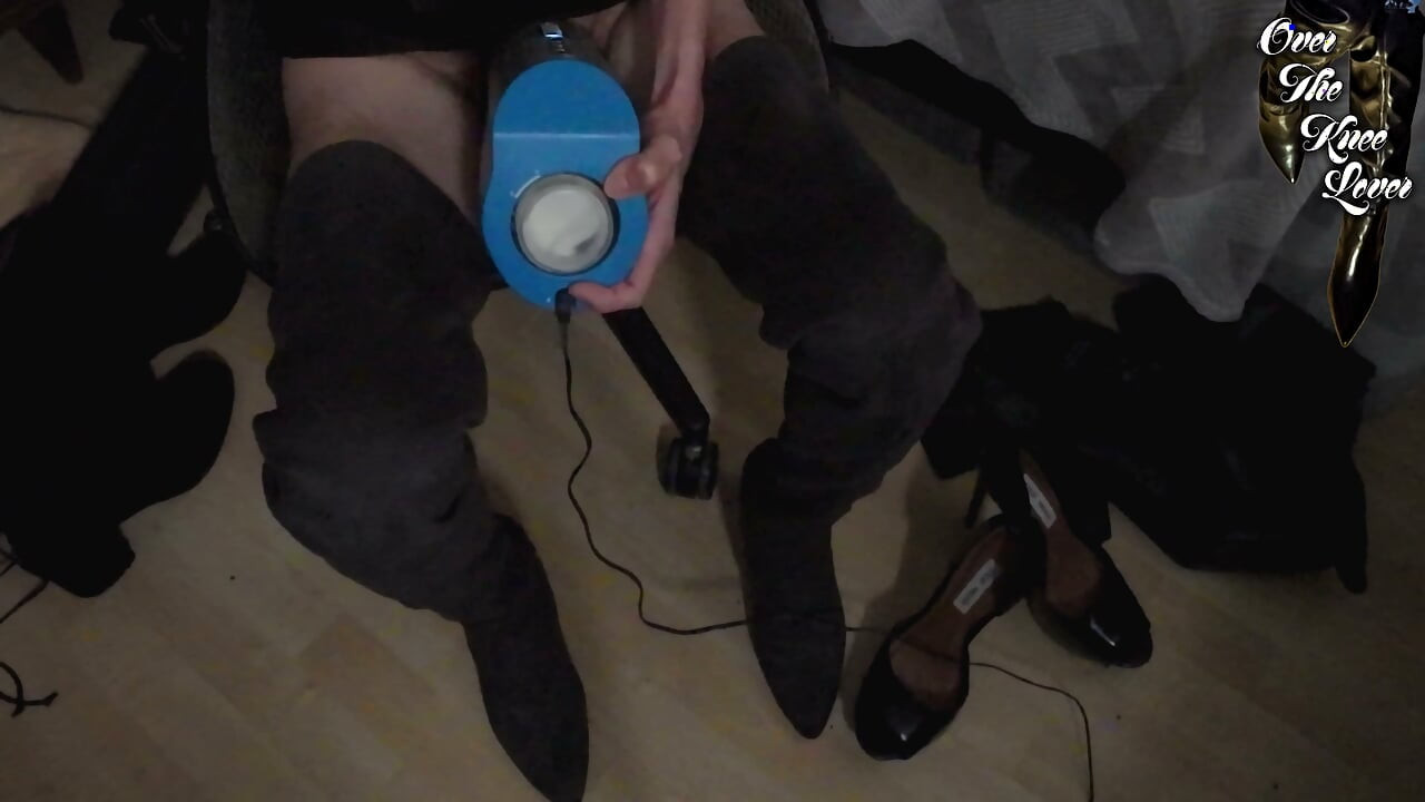 crossdresser autoblows in a leather dress and suede thigh high boots