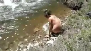 taking a bath at the river