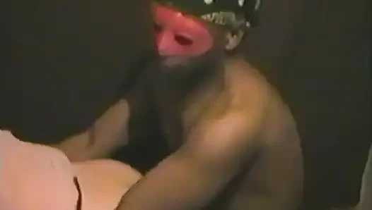 An Interracial Couple in Fetish Masks Fuck on Camera