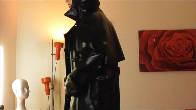 Rubber Mistress M wanks on Floor