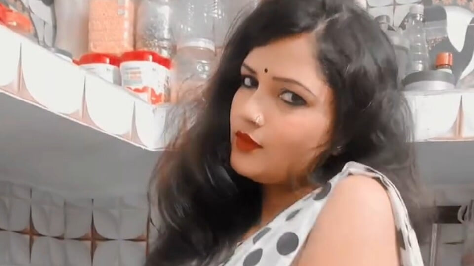 Tina Nandy and Tejaswini Prabhakar whispering in the dark