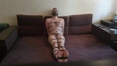 Tightly tape tied, gagged, blindfolded and naked