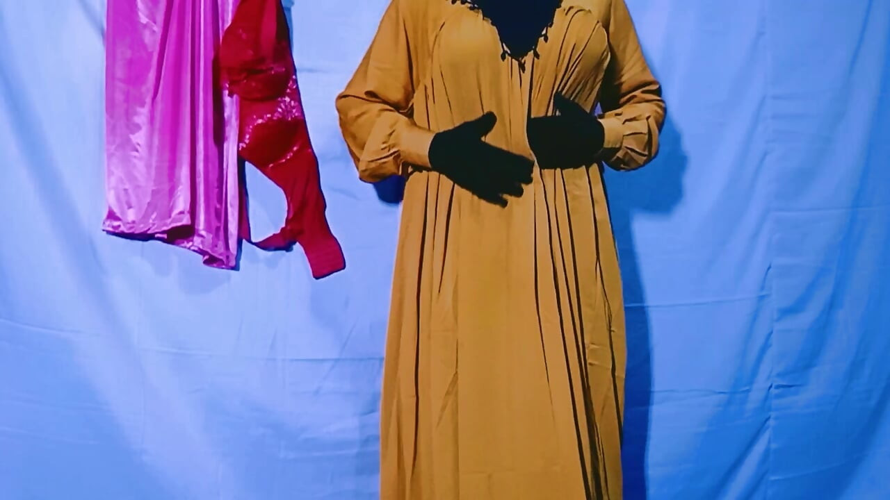 Indian wife sewing on the machine but she has other thoughts too