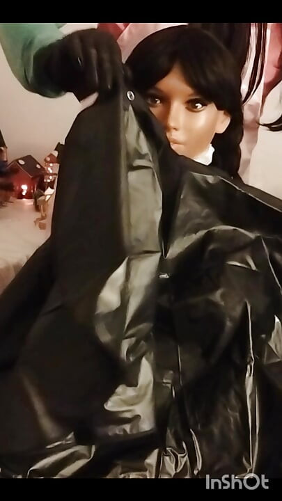 Ebony Sex doll Nikki shows off vinyl shampoo capes