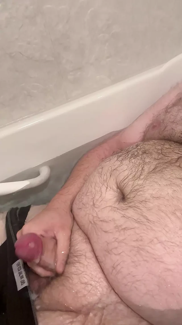 Chubby Fat Bear plays with small uncut cock in bathtub