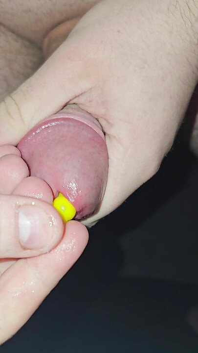 Inserting a small silicone sound all the way in my cock, then putting another one on top.