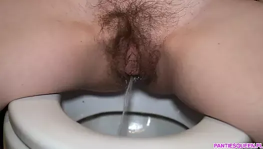 Very hairy pussy pissing in the toilet close up