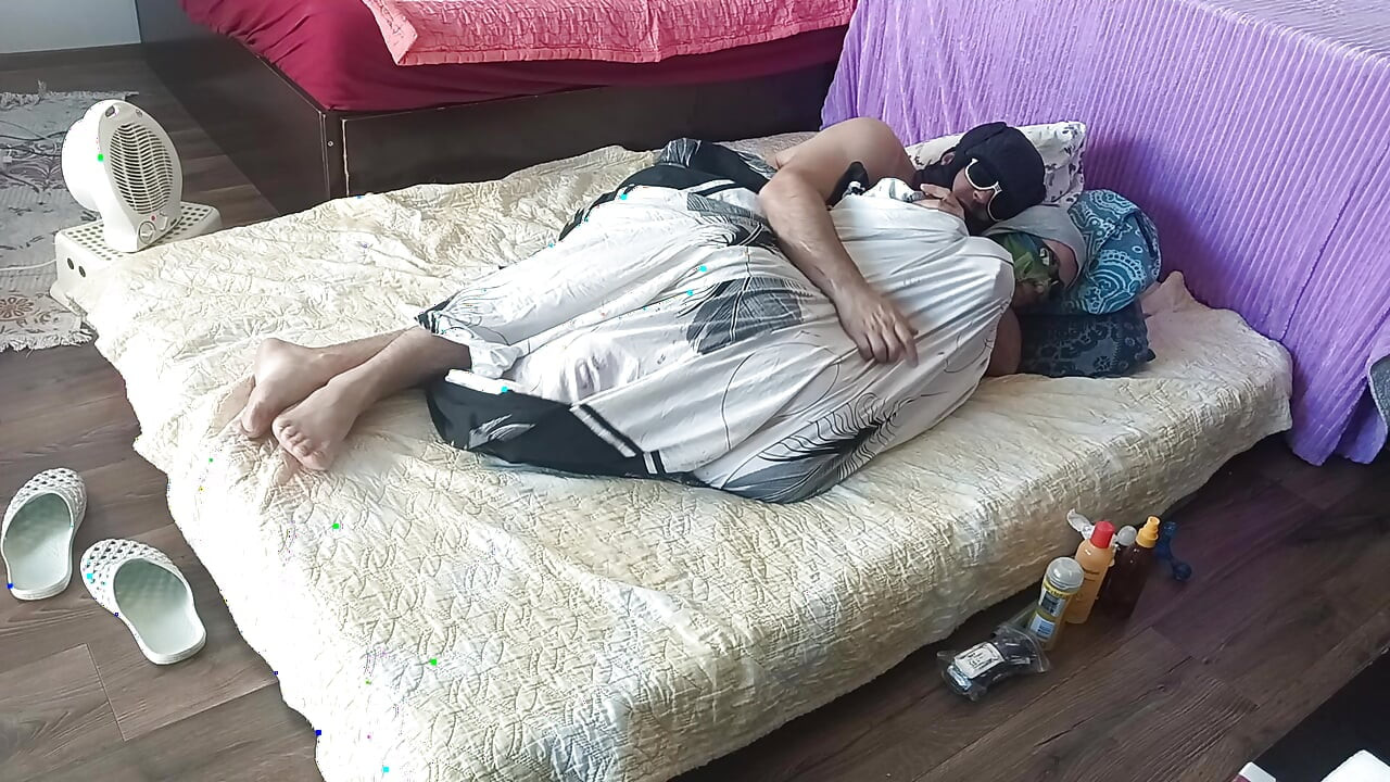 Sensual massage of a sexy couple with oil on the body. Foreplay in the bedroom with an amateur couple.