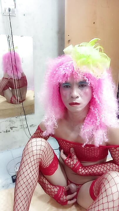 Oanh Le transgender wearing sexy lingerie playing with a fake can