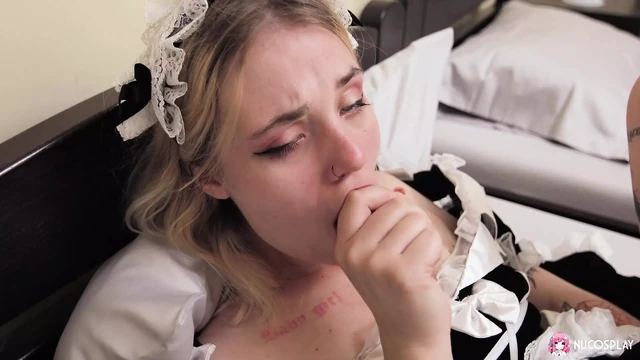 Horny tattooed maid Angelina Bong plays in bed with a sex toy.