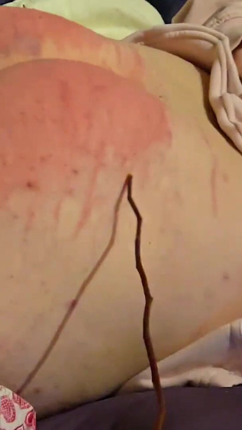 Cruel whipping of a slave with rods, femdom punishment by a sadistic mistress. | Clip 1