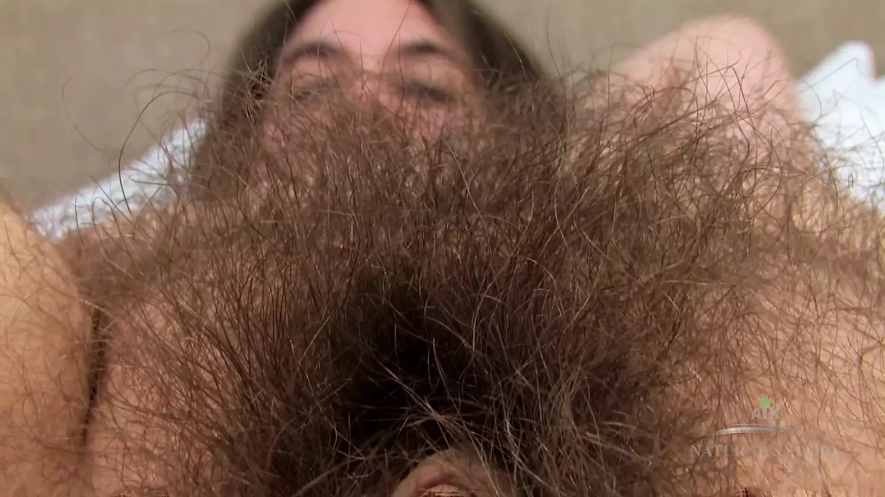 Hairy pussy babe Brooke strips down to show off her amazing fur