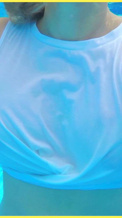 Wifey goes for a swim in a white shirt braless which shows her perfect tits in the water | Clip 1