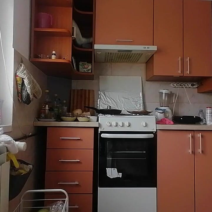 A Sexy Naked Woman Prepares Food in the Kitchen