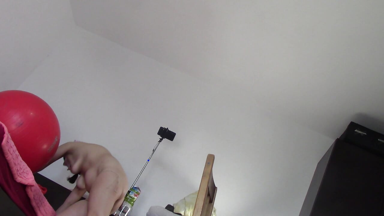 Amateur wife dancing naked at home. Amateur woman has fun trying on clothes and cutting them.