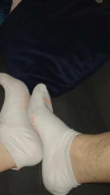 old worn white stockings ( male feet)