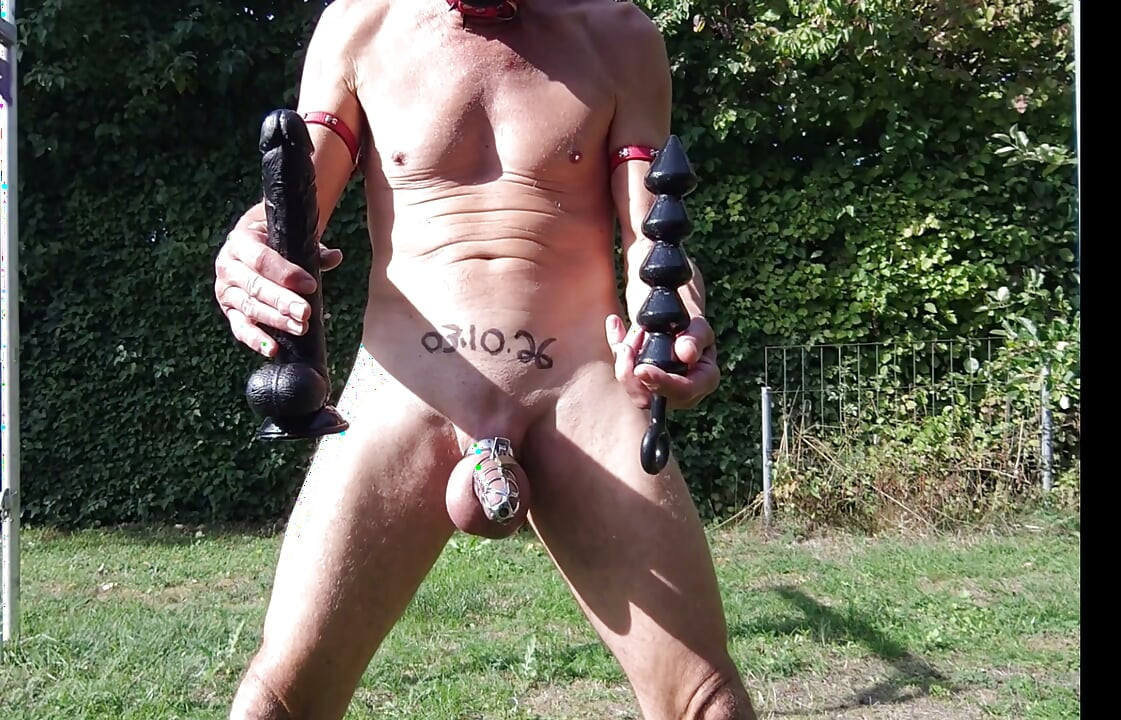 dirty gay slave pig outdoor in peniscage may play with dildo in ass