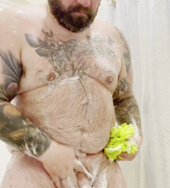 Sexy Tattooed bear lathering up in the shower soapy