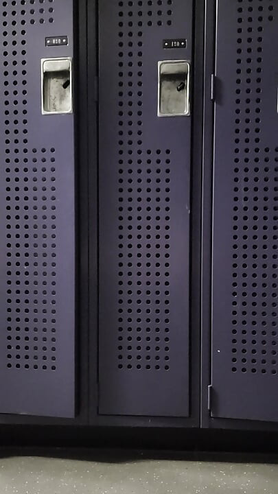 oiled, masturbating in a gym locker room