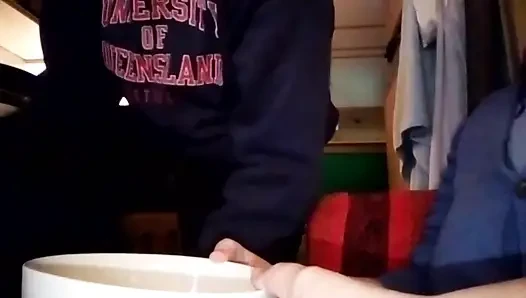Jen is filming John when he is peeing into a small bowl