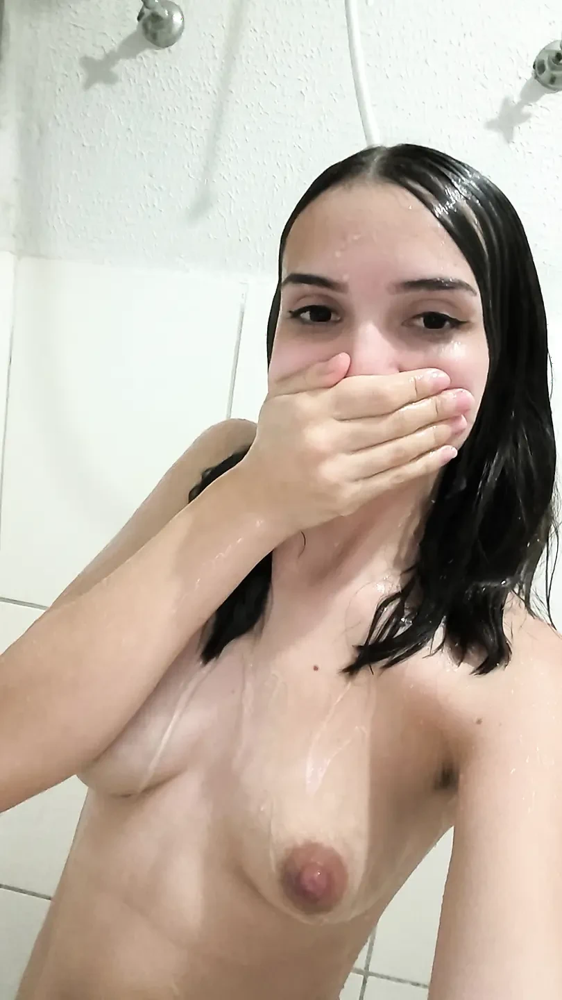 Brunette takes a shower and shaves