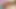 二人の美しく官能的な猫娘たちが、晴れた熱帯のビーチパラダイスで全裸でリラックスしている