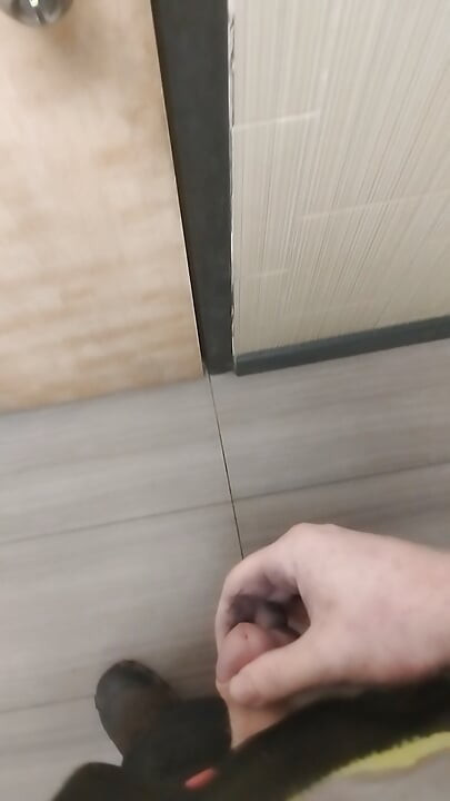 Jerking and cumming in public bathroom hallway