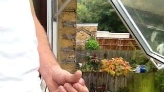 Masturbating out of the window 2