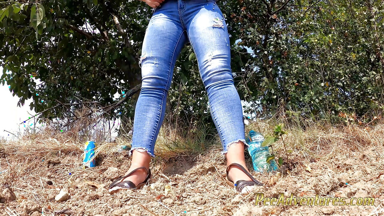 Chubby girl talking on the phone with her boy friend pee in her jeans