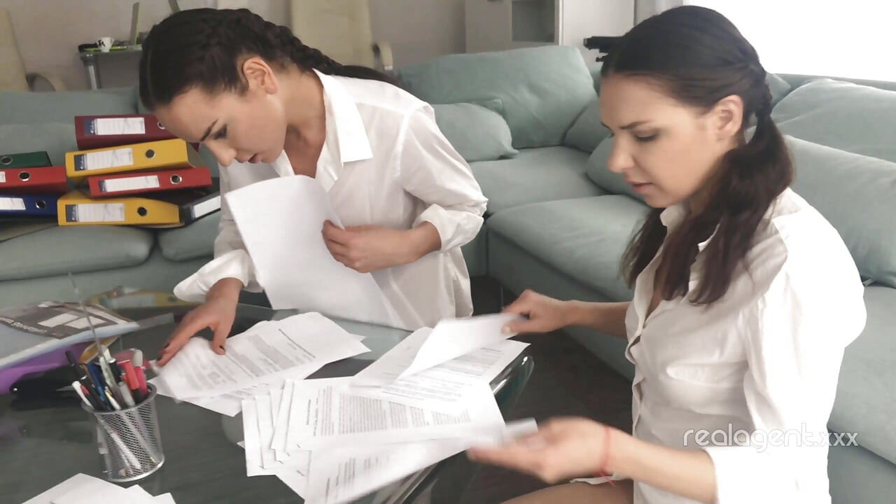 Couple of cute brunette students celebrate successful examination