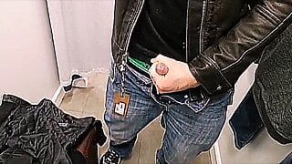 Leather Jacket wank and cum in store changing rooms.