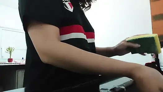 Woman teasing while washing dishes. She loves to transmit to the voyeurs on duty