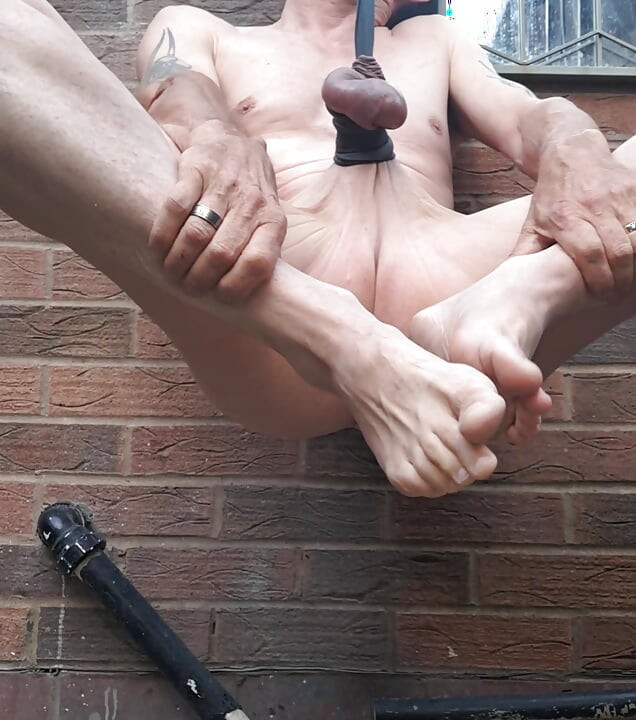 Hanging from my cock And balls on a lovely sunny morning
