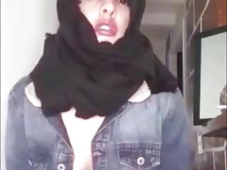 Arab wearing burqa and kneeling for her master