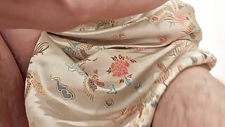 A perverted man in a cheongsam masturbates wearing girl's panties