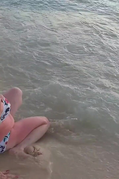 Woman Presenting Herself on the Beach