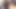 Two Hung and Busty trans girls wearing sexy bodystockings and high heels laying on the bed next to each other stroking their big